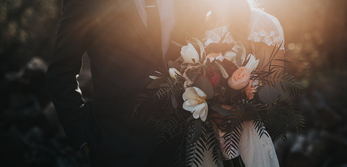 Groom and bride with bouquet